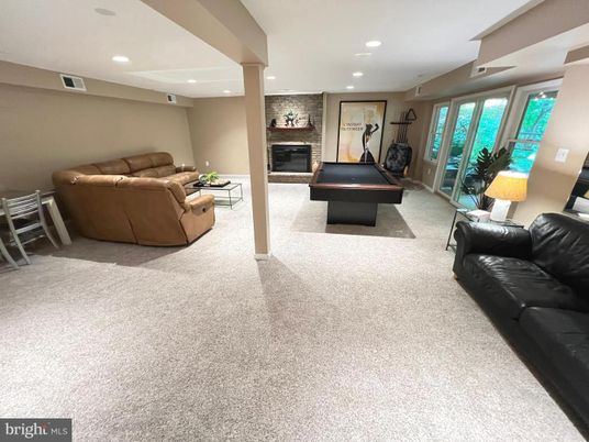 Billiard Table, Fireplace, Fitness Equipment, Game Room, Interior, Living room, Recessed Lighting, Stone Walls