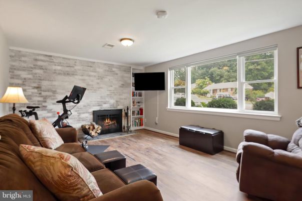 Fireplace, Fitness Equipment, Interior, Living room, Stone Walls, Wood Texture Flooring