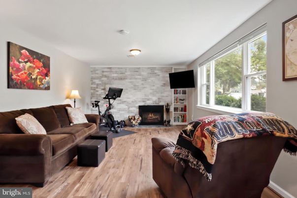 Fireplace, Fitness Equipment, Interior, Living room, Stone Walls, Wood Texture Flooring