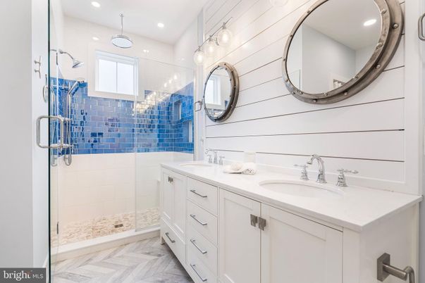 Bathroom, Dual Sink Vanities, Glass Shower, Interior, Pendant Lights, Recessed Lighting, Wood Texture Flooring