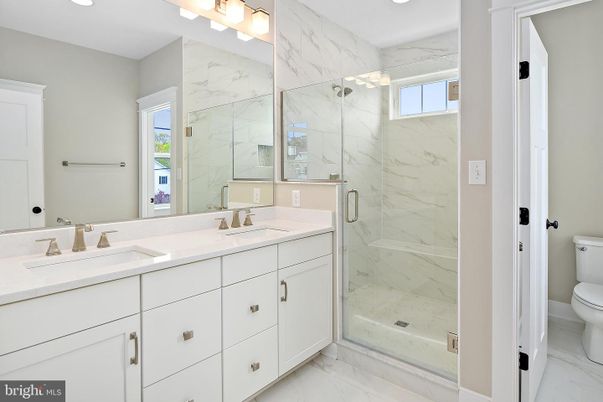 Bathroom, Dual Sink Vanities, Glass Shower, Interior, Marble, Marble Walls, Recessed Lighting