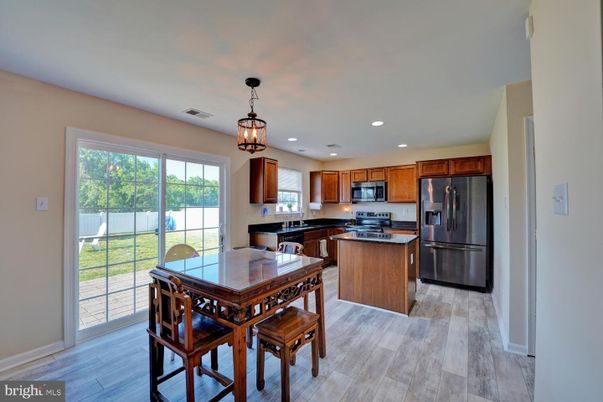 Dining room, Interior, Kitchen, Pendant Lights, Recessed Lighting, Stainless Steel Appliances, Wood Texture Flooring