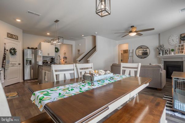Dining room, Fireplace, Interior, Kitchen, Pendant Lights, Recessed Lighting, Stainless Steel Appliances, Wood Texture Flooring