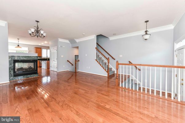 Chandelier, Empty room, Fireplace, Interior, Pendant Lights, Recessed Lighting, Wood Texture Flooring