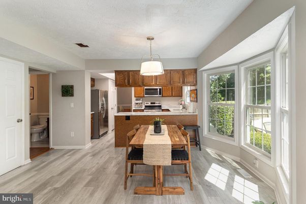 Dining room, Interior, Kitchen, Pendant Lights, Stainless Steel Appliances, Wood Texture Flooring