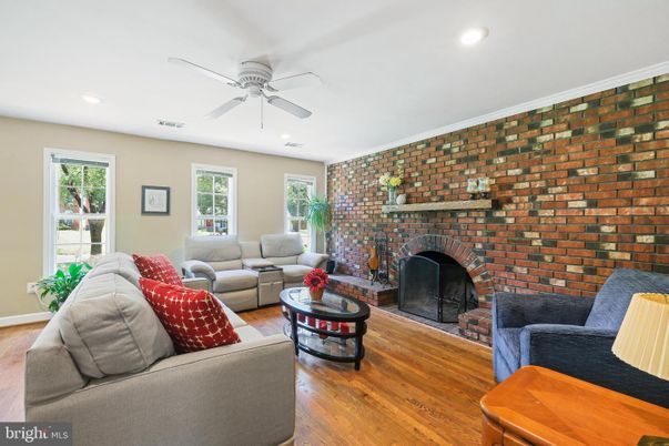 Fireplace, Interior, Living room, Recessed Lighting, Stone Walls, Wood Texture Flooring