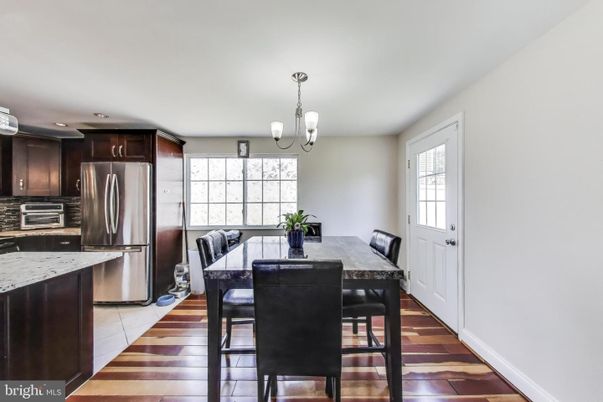 Chandelier, Dining room, Interior, Kitchen, Recessed Lighting, Stainless Steel Appliances, Wood Texture Flooring
