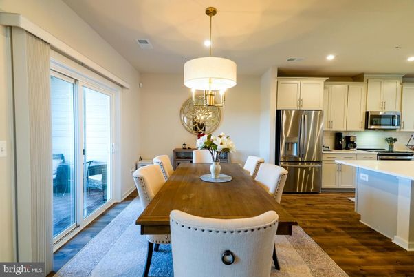 Dining room, Interior, Kitchen, Pendant Lights, Recessed Lighting, Stainless Steel Appliances, Wood Texture Flooring