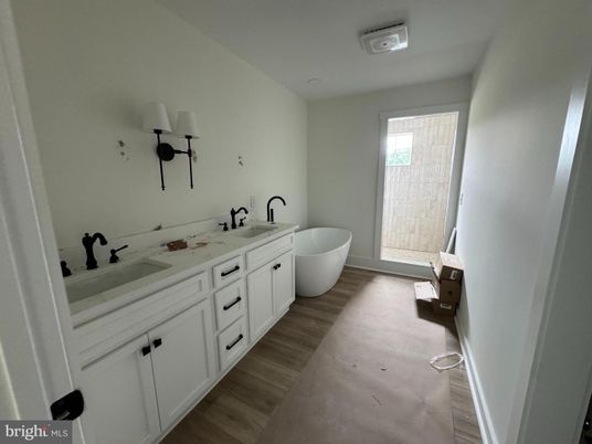 Bathroom, Dual Sink Vanities, Free Standing Baths, Interior, Wood Texture Flooring