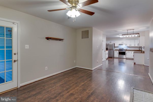 Empty room, Interior, Kitchen, Pendant Lights, Stainless Steel Appliances, Wood Texture Flooring