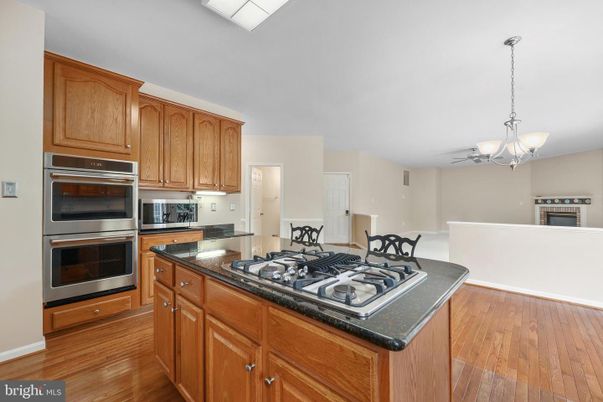 Chandelier, Interior, Kitchen, Pendant Lights, Stainless Steel Appliances, Wood Texture Flooring