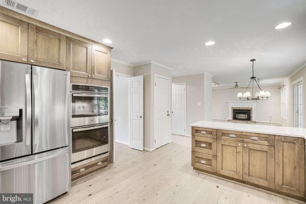 Chandelier, Interior, Kitchen, Pendant Lights, Recessed Lighting, Stainless Steel Appliances, Wood Texture Flooring