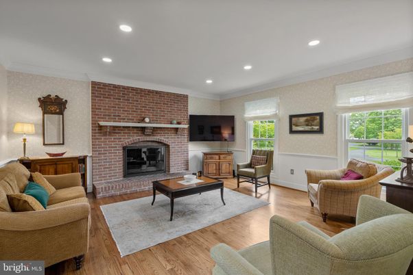 Fireplace, Interior, Living room, Recessed Lighting, Stone Walls, Wood Texture Flooring