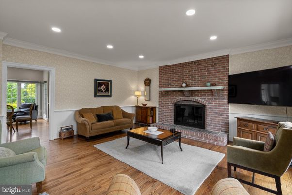 Fireplace, Interior, Living room, Recessed Lighting, Stone Walls, Wood Texture Flooring