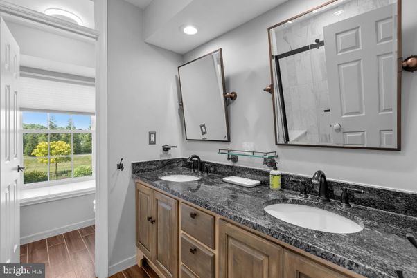 Bathroom, Dual Sink Vanities, Interior, Recessed Lighting, Wood Texture Flooring
