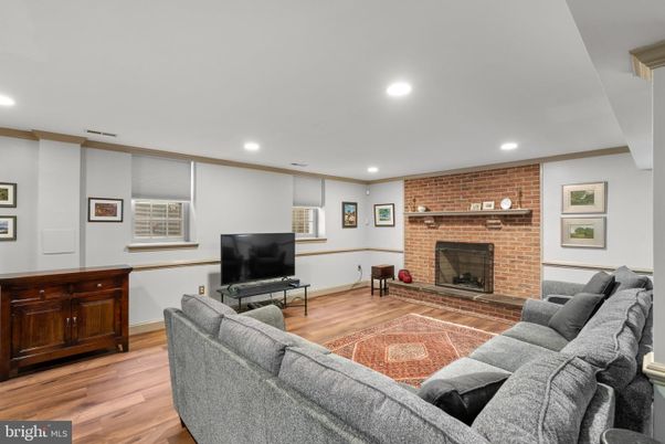 Fireplace, Interior, Living room, Recessed Lighting, Stone Walls, Wood Texture Flooring