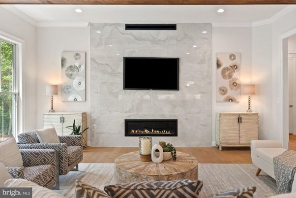 Fireplace, Interior, Living room, Marble Walls, Recessed Lighting, Wood Texture Flooring