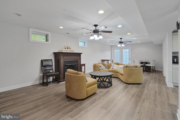 Dining room, Fireplace, Interior, Living room, Recessed Lighting, Wood Texture Flooring