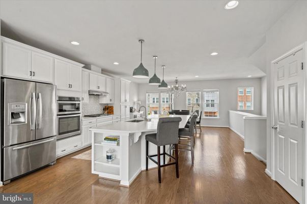 Chandelier, Dining room, Interior, Kitchen, Pendant Lights, Recessed Lighting, Stainless Steel Appliances, Wood Texture Flooring