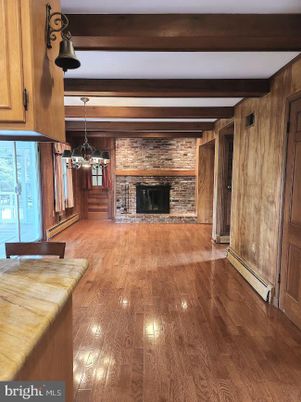 Empty room, Fireplace, Interior, Pendant Lights, Stone Walls, Wooden Beams, Wood Texture Flooring, Wooden Walls