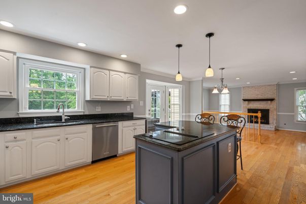 Fireplace, Interior, Kitchen, Pendant Lights, Recessed Lighting, Stone Walls, Wood Texture Flooring