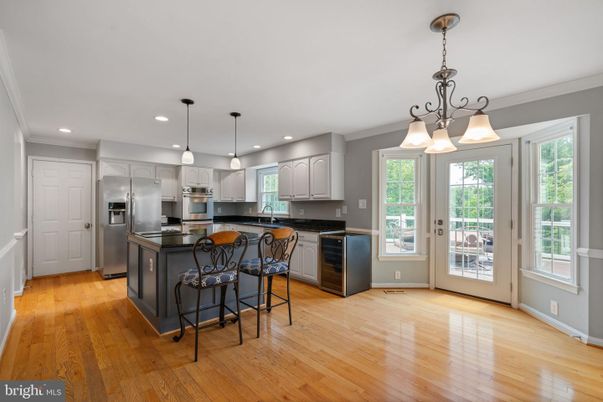 Chandelier, Interior, Kitchen, Pendant Lights, Recessed Lighting, Stainless Steel Appliances, Wood Texture Flooring