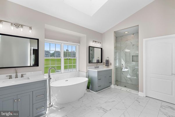Bathroom, Dual Sink Vanities, Free Standing Baths, Glass Shower, Interior, Marble, Marble Walls, Recessed Lighting