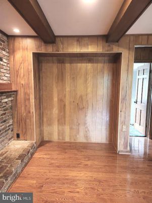 Empty room, Fireplace, Interior, Recessed Lighting, Stone Walls, Wood Texture Flooring, Wooden Walls