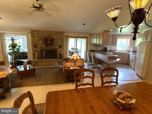 Dining room, Fireplace, Interior, Kitchen, Living room, Recessed Lighting, Stone Walls, Wood Texture Flooring