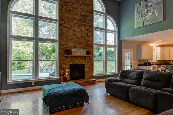 Fireplace, Interior, Kitchen, Living room, Recessed Lighting, Stone Walls, Wood Texture Flooring
