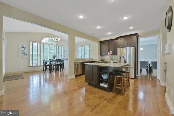 Chandelier, Dining room, Interior, Kitchen, Recessed Lighting, Stainless Steel Appliances, Wood Texture Flooring