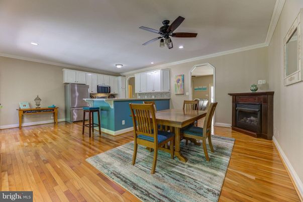 Dining room, Fireplace, Interior, Kitchen, Recessed Lighting, Wood Texture Flooring