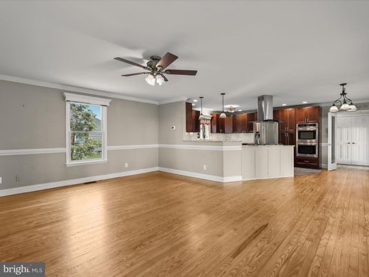 Chandelier, Empty room, Interior, Kitchen, Pendant Lights, Recessed Lighting, Stainless Steel Appliances, Wood Texture Flooring