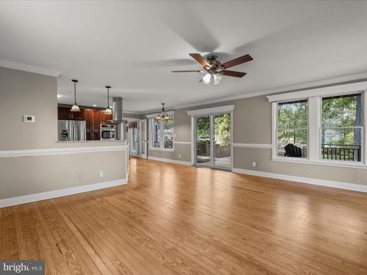 Empty room, Interior, Kitchen, Pendant Lights, Stainless Steel Appliances, Wood Texture Flooring