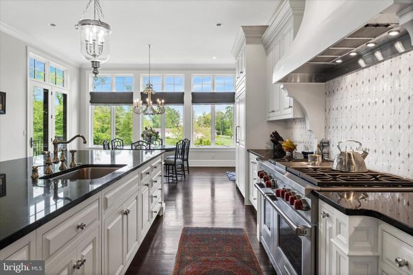 Chandelier, Dining room, Interior, Kitchen, Pendant Lights, Recessed Lighting, Stainless Steel Appliances, Wood Texture Flooring