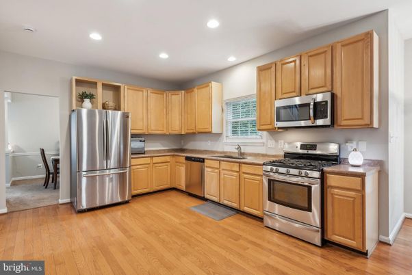 Dining room, Interior, Kitchen, Recessed Lighting, Stainless Steel Appliances, Wood Texture Flooring