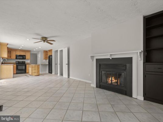 Empty room, Fireplace, Interior, Kitchen, Recessed Lighting, Stainless Steel Appliances