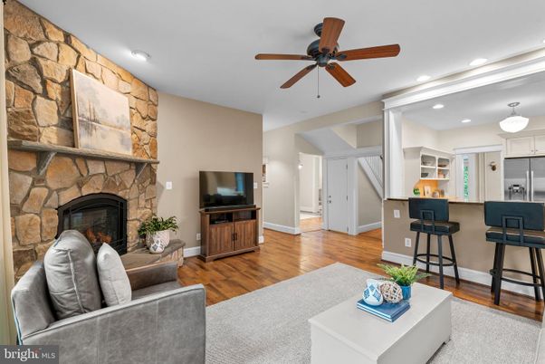 Fireplace, Interior, Kitchen, Living room, Recessed Lighting, Stone Walls, Wood Texture Flooring
