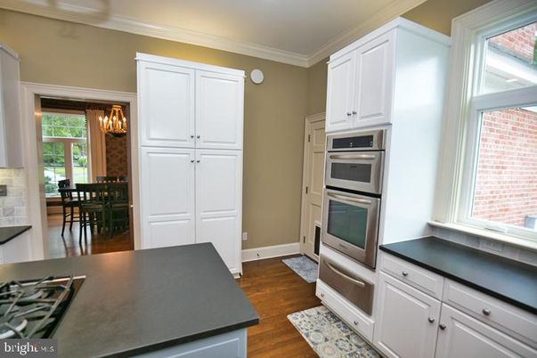 Chandelier, Dining room, Interior, Kitchen, Stainless Steel Appliances, Wood Texture Flooring
