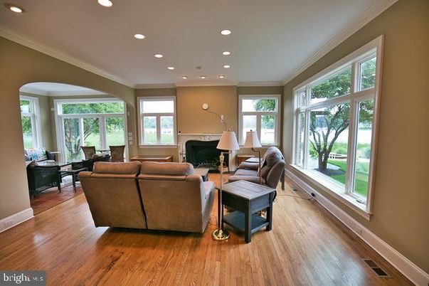 Dining room, Fireplace, Interior, Living room, Recessed Lighting, Wood Texture Flooring