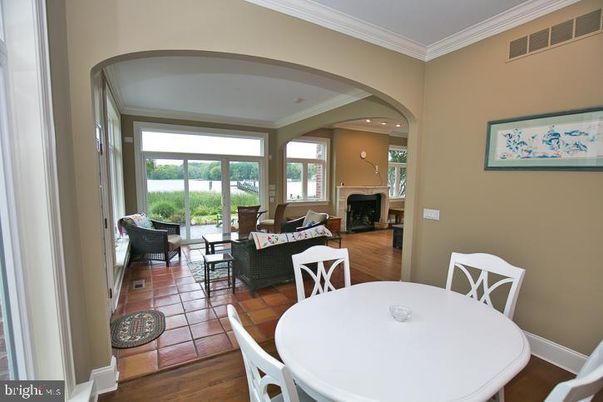 Dining room, Fireplace, Interior, Living room, Recessed Lighting, Wood Texture Flooring