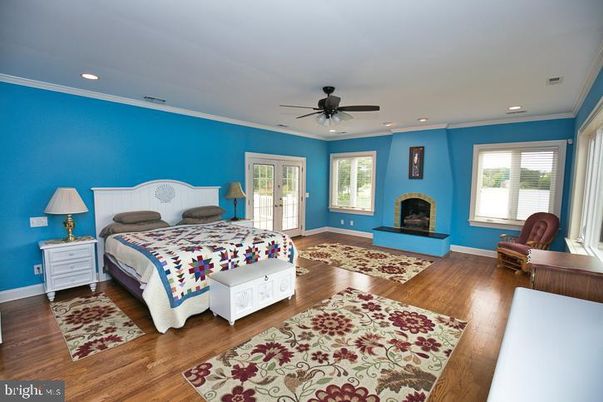 Bedroom, Fireplace, Interior, Recessed Lighting, Wood Texture Flooring