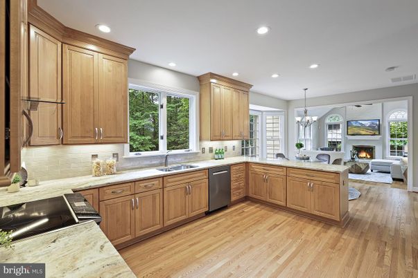 Chandelier, Fireplace, Interior, Kitchen, Living room, Recessed Lighting, Wood Texture Flooring
