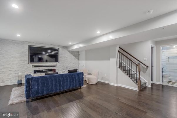 Bathroom, Fireplace, Interior, Living room, Recessed Lighting, Stone Walls, Wood Texture Flooring