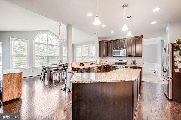 Chandelier, Dining room, Interior, Kitchen, Pendant Lights, Recessed Lighting, Stainless Steel Appliances, Wood Texture Flooring