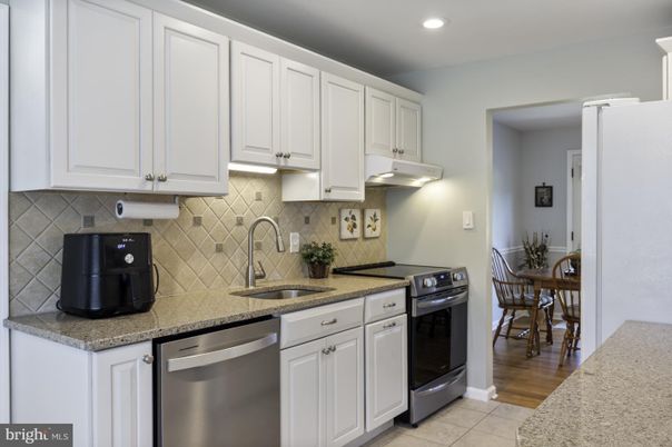 Dining room, Interior, Kitchen, Recessed Lighting, Stainless Steel Appliances, Wood Texture Flooring