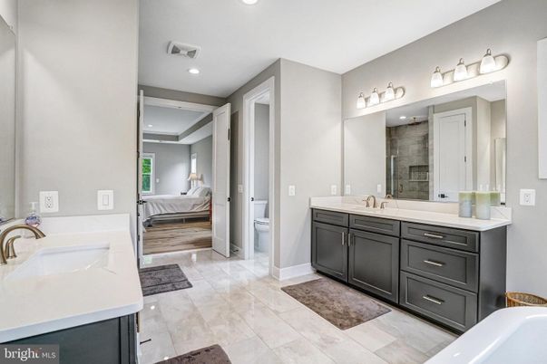 Bathroom, Bedroom, Dual Sink Vanities, Interior, Recessed Lighting, Wood Texture Flooring