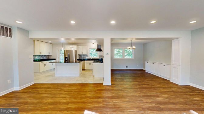Chandelier, Empty room, Interior, Kitchen, Pendant Lights, Recessed Lighting, Stainless Steel Appliances, Wood Texture Flooring