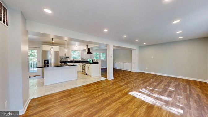 Empty room, Interior, Kitchen, Pendant Lights, Recessed Lighting, Stainless Steel Appliances, Wood Texture Flooring