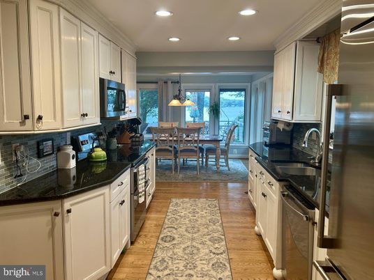Dining room, Interior, Kitchen, Pendant Lights, Recessed Lighting, Stainless Steel Appliances, Wood Texture Flooring